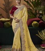 designer yellow soft jacquard fabric saree with maroon silk blend blouse fabric