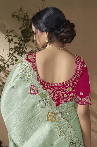 designer green viscose fabric saree with rani pink silk blend blouse fabric
