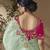 designer green viscose fabric saree with rani pink silk blend blouse fabric