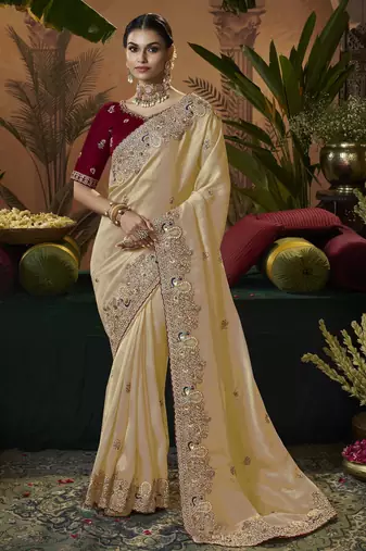 designer gold soft jacquard fabric saree with maroon silk blend blouse fabric