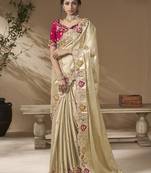 designer gold viscose fabric saree with rani pink silk blend blouse fabric