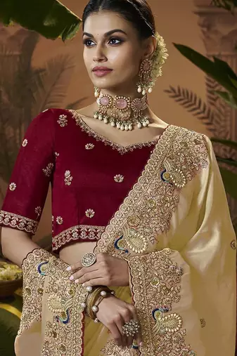 designer gold soft jacquard fabric saree with maroon silk blend blouse fabric