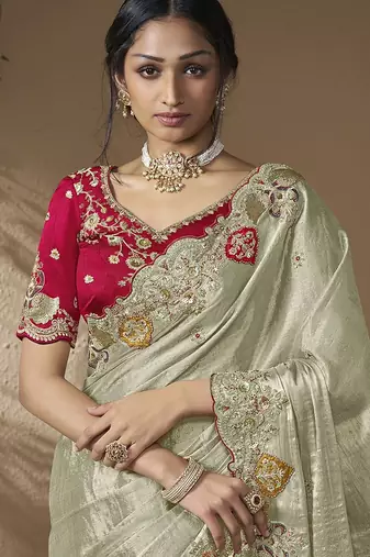 designer dusty green viscose fabric saree with rani pink silk blend blouse fabric