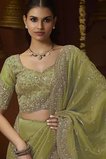 Designer green tissue fabric saree with green tissue blouse fabric