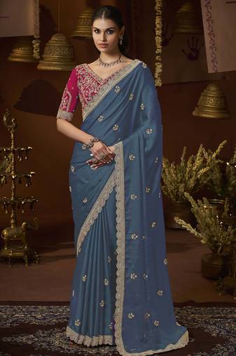designer green satin fabric saree with rani pink silk blend blouse fabric