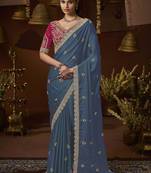 designer green satin fabric saree with rani pink silk blend blouse fabric