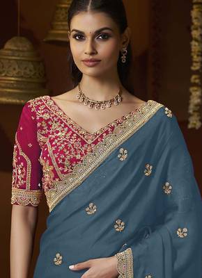 designer green satin fabric saree with rani pink silk blend blouse fabric 2
