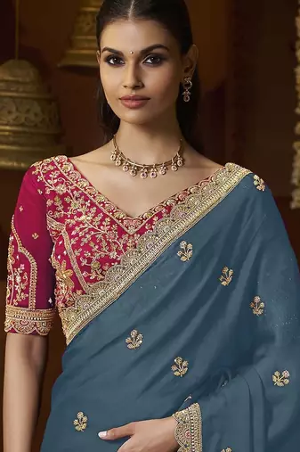 designer green satin fabric saree with rani pink silk blend blouse fabric