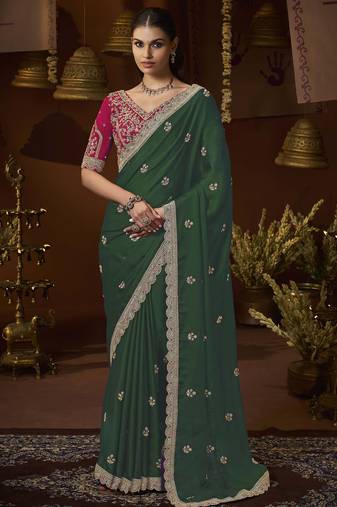 designer green satin fabric saree with rani pink silk blend blouse fabric