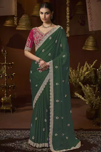 designer green satin fabric saree with rani pink silk blend blouse fabric