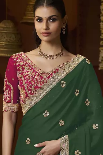 designer green satin fabric saree with rani pink silk blend blouse fabric