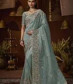Designer green tissue fabric saree with green tissue blouse fabric