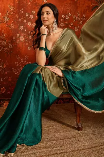 Green tissue satin embellished saree with unstitched blouse piece.