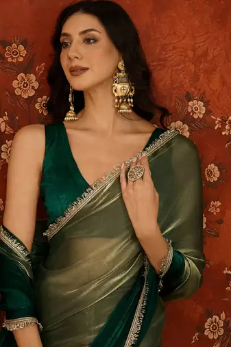 Green tissue satin embellished saree with unstitched blouse piece.