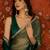 Green tissue satin embellished saree with unstitched blouse piece.