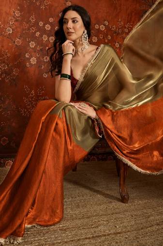 Orange tissue satin embellished saree with unstitched blouse piece.