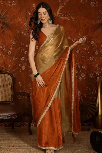 Orange tissue satin embellished saree with unstitched blouse piece.