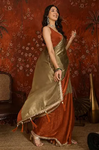 Orange tissue satin embellished saree with unstitched blouse piece.