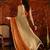 Orange tissue satin embellished saree with unstitched blouse piece.