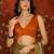 Orange tissue satin embellished saree with unstitched blouse piece.