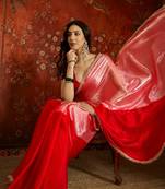 Red tissue satin embellished saree with unstitched blouse piece.