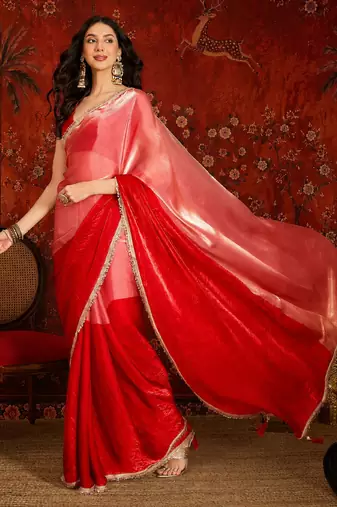 Red tissue satin embellished saree with unstitched blouse piece.