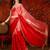 Red tissue satin embellished saree with unstitched blouse piece.