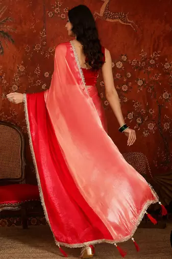 Red tissue satin embellished saree with unstitched blouse piece.