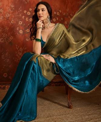 Teal tissue satin embellished saree with unstitched blouse piece. 1