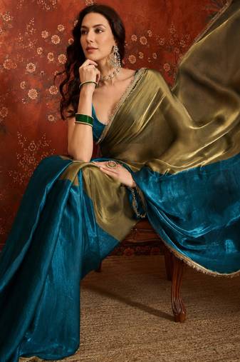 Teal tissue satin embellished saree with unstitched blouse piece.