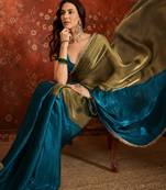 Teal tissue satin embellished saree with unstitched blouse piece.