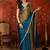 Teal tissue satin embellished saree with unstitched blouse piece.
