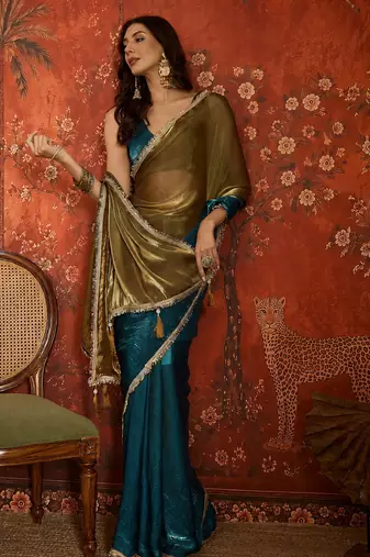 Teal tissue satin embellished saree with unstitched blouse piece.