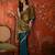 Teal tissue satin embellished saree with unstitched blouse piece.