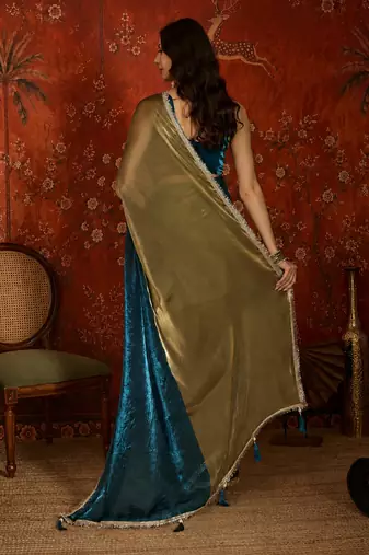 Teal tissue satin embellished saree with unstitched blouse piece.