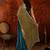 Teal tissue satin embellished saree with unstitched blouse piece.