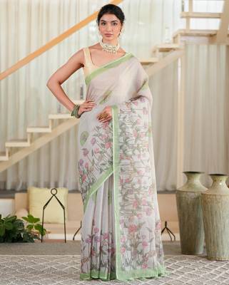 kusumita linen saree with hand painted flowers. sequence work over them. blouse fabric given inside the saree. 1
