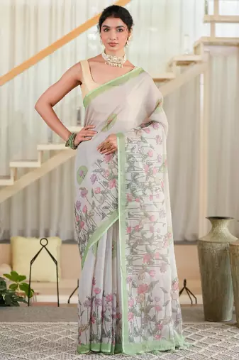 kusumita linen saree with hand painted flowers. sequence work over them. blouse fabric given inside the saree.