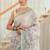 kusumita linen saree with hand painted flowers. sequence work over them. blouse fabric given inside the saree.