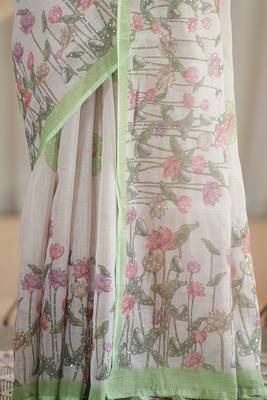 kusumita linen saree with hand painted flowers. sequence work over them. blouse fabric given inside the saree. 4