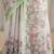 kusumita linen saree with hand painted flowers. sequence work over them. blouse fabric given inside the saree.
