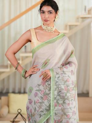 kusumita linen saree with hand painted flowers. sequence work over them. blouse fabric given inside the saree. 5