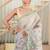 kusumita linen saree with hand painted flowers. sequence work over them. blouse fabric given inside the saree.