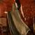 Olive tissue satin embellished saree with unstitched blouse piece.