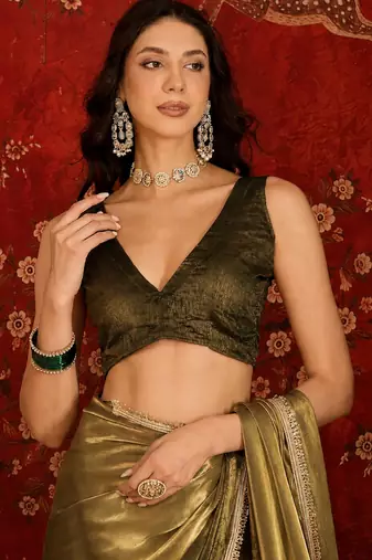 Olive tissue satin embellished saree with unstitched blouse piece.