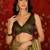 Olive tissue satin embellished saree with unstitched blouse piece.