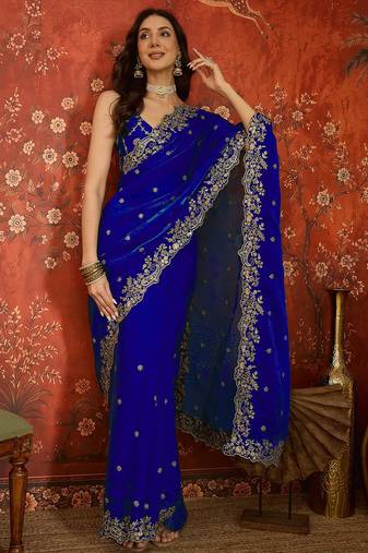 Blue tissue satin embroidered saree with unstitched blouse piece.