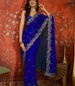 Blue tissue satin embroidered saree with unstitched blouse piece.