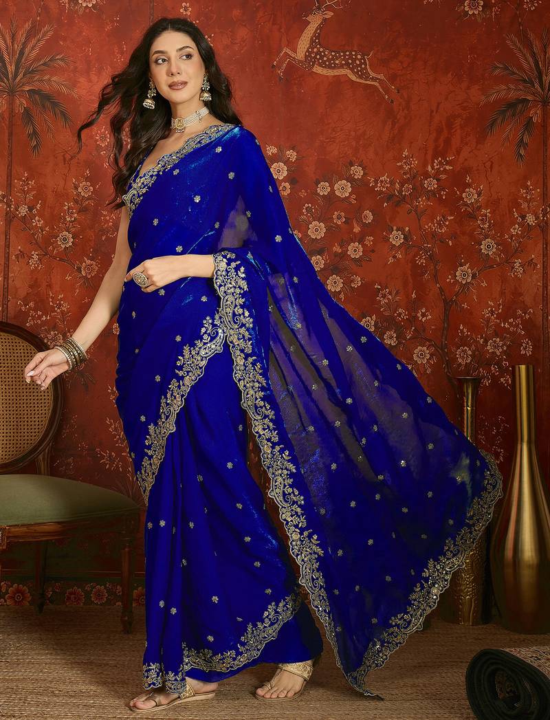 Blue tissue satin embroidered saree with unstitched blouse piece.