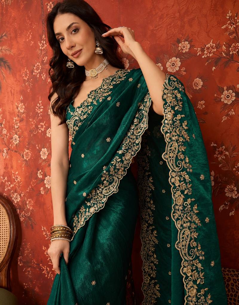Bottle green tissue satin embroidered saree with unstitched blouse piece.